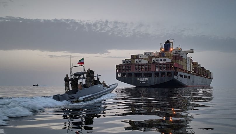 FILE - In this photo released by Tasnim News Agency, a Revolutionary Guard Navy (IRGC) speedboat approaches the cargo ship Epaminondas during what state media described as the