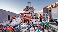 Volunteers clearing up Greece's polluted beaches.