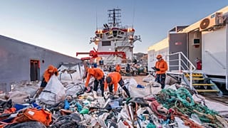 Volunteers clearing up Greece's polluted beaches.