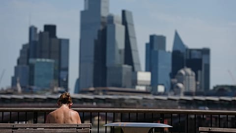 A woman sunbathes in London.