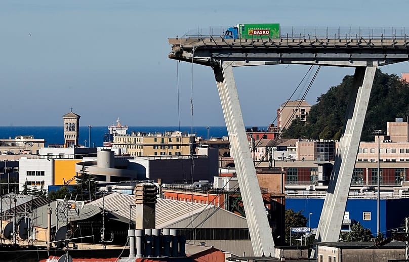 A vehicle sits short of a section of the Morandi highway bridge that collapsed on 15 Aug., 2018, in Genoa, northern Italy. (AP Photo/Antonio Calanni, File)