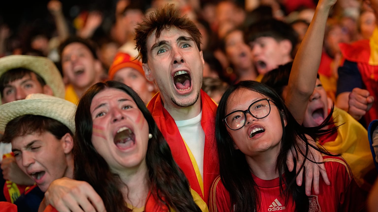 Fans celebrate in central Madrid after Spain scored their second goal in the World Cup semi-final against France in Arlington, on 14 July.