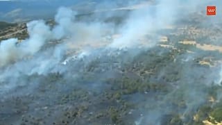 Vista do incêndio florestal declarado em Lozoyuela, a norte da Comunidade de Madrid, 16 de julho de 2026