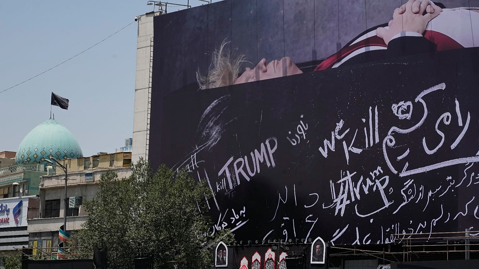 A billboard depicting Donald Trump lying on what appears to be a coffin, and bearing anti-Trump messages in the Islamic Revolution Square in Tehran, Iran. July 15, 2026.
