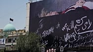 A billboard depicting Donald Trump lying on what appears to be a coffin, and bearing anti-Trump messages in the Islamic Revolution Square in Tehran, Iran. July 15, 2026.