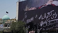 A billboard depicting Donald Trump lying on what appears to be a coffin, and bearing anti-Trump messages in the Islamic Revolution Square in Tehran, Iran. July 15, 2026.