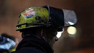 File - A Save our Steel sticker is pictured on the helmet of a worker at one of the Blast Furnaces at British Steel's steelworks site in Scunthorpe, England. 15 April 2025