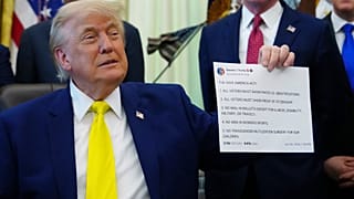 President Donald Trump holds up an image taken from his File - Truth Social account at an event about coal, on 4 June 2026, in the Oval Office of the White House in Washington