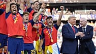 Spain players cheer alongside President Donald Trump and FIFA President Gianni Infantino at the conclusion of the World Cup championship, 19 July 2026.