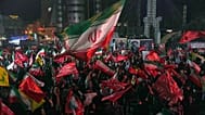 Pro-government demonstrators gather at a square in Tehran, Friday, July 17, 2026.
