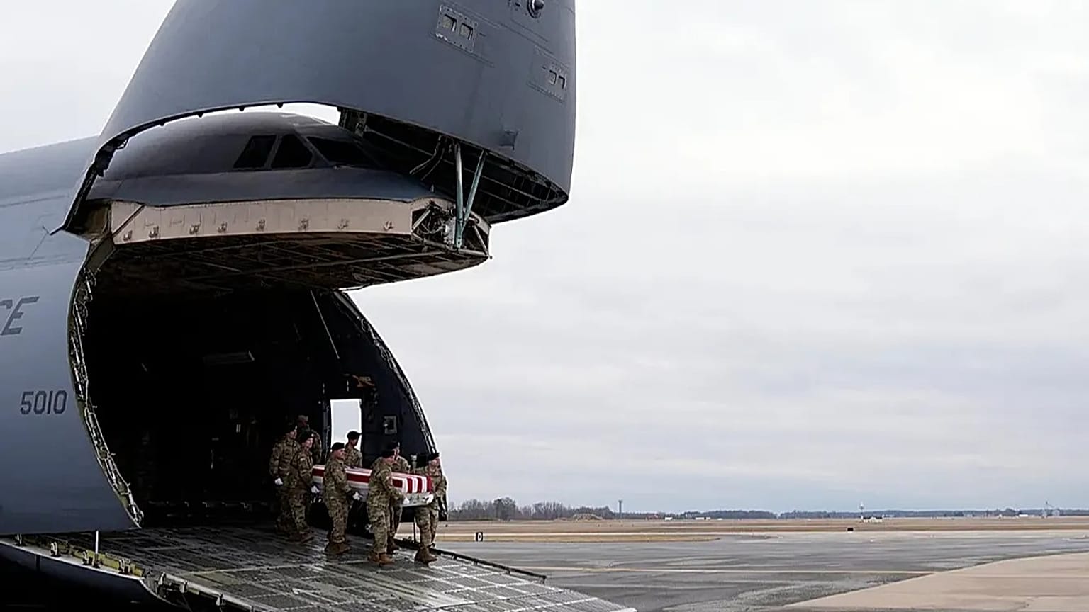 FILE- US Army carry team moves the flag-draped transfer case containing remains of Sgt. Kennedy Ladon Sanders, 24, of Waycross, Ga on Friday, Feb. 2, 2024. 