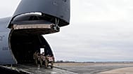 FILE- US Army carry team moves the flag-draped transfer case containing remains of Sgt. Kennedy Ladon Sanders, 24, of Waycross, Ga on Friday, Feb. 2, 2024. 