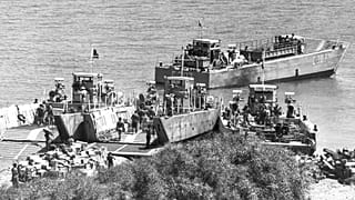 Turkish army supplies are unloaded from landing craft onto the beaches near the northern port of Kyrenia, Cyprus 27 July, 1974