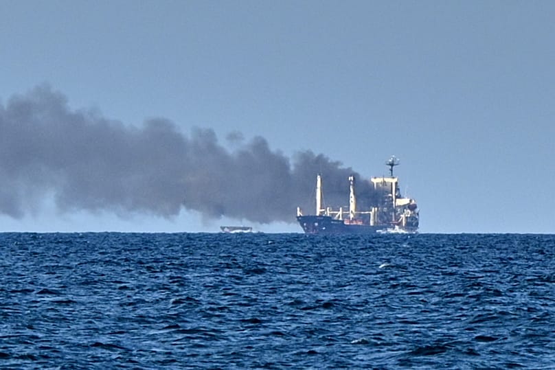 Smoke rises from the grain carrier Golden Leo under the Guinea-Bissau flag after Russian missile strike in the Black Sea close to Odesa, 19 July, 2026