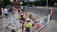 Construction workers work on a street during a hot day in Madrid, Spain, 27 May 2026