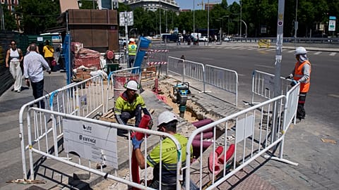 Construction workers work on a street during a hot day in Madrid, Spain, 27 May 2026