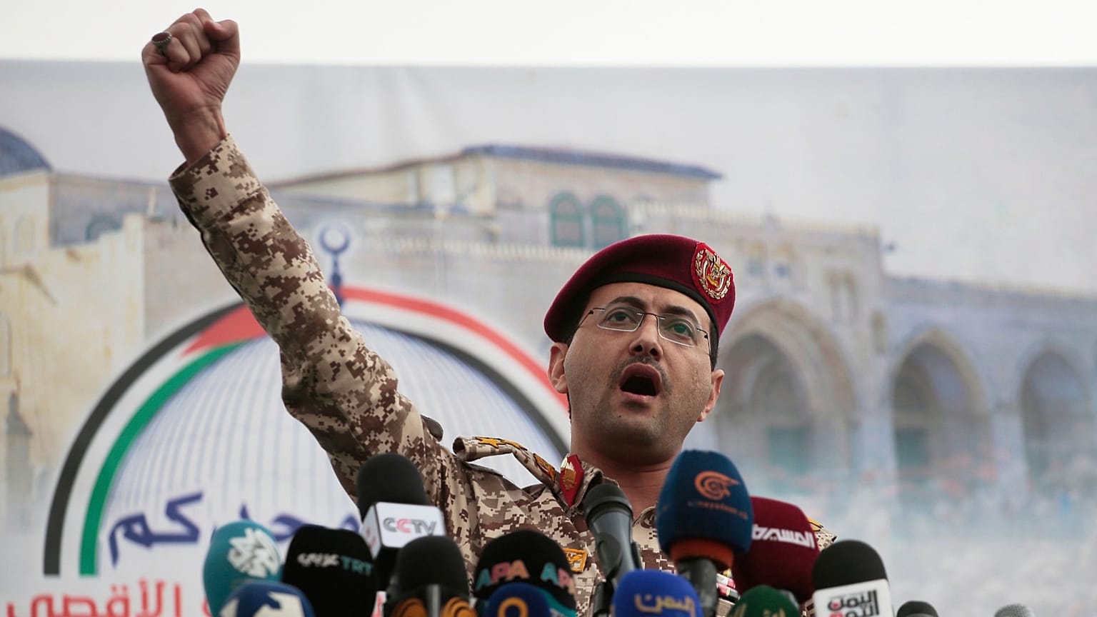 Houthi military spokesman Yahya Saree speaks at a rally against the US and Israel in Sanaa, 18 April 2025