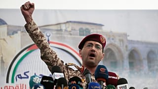 Houthi military spokesman Yahya Saree speaks at a rally against the US and Israel in Sanaa, 18 April 2025