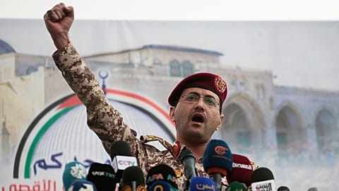 Houthi military spokesman Yahya Saree speaks at a rally against the US and Israel in Sanaa, 18 April 2025