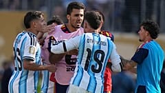 Argentina's Nicolás Otamendi and Nahuel Molina clash with Spain's Rodri (16) after the World Cup final between Spain and Argentina in New Jersey.