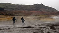  FILE ** In this Feb. 22, 2006 file photo tourists brave the weather to walk around the hot springs area at the site of Geysir, Iceland. (AP Photo/Kirsty Wigglesworth, File)
