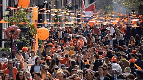 Orange-clad people celebrate King's Day in Amsterdam, Netherlands, Thursday, April 27, 2023. The Netherlands celebrated the 56th birthday of King Willem-Alexander of the House