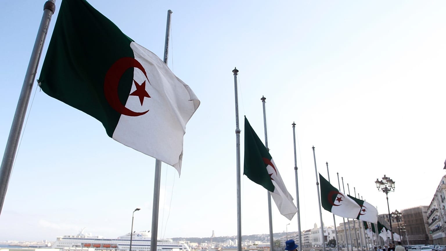 FILE - Algerian flags fly at half-mast along the waterfront promenade in Algiers on Saturday 18 September 2021. (AP Photo/Fateh Guidoum, File)