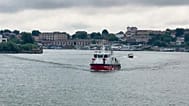 Romanian Inspectorate for Emergency Situations shows a rescue ship evacuating injured crew members approaching the port in Tulcea, Romania, Tuesday, July 21, 2026