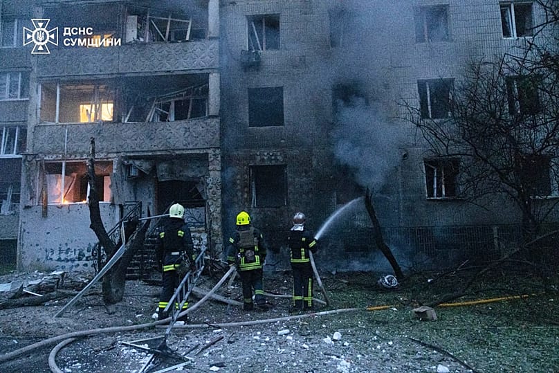 In this photo provided by the Ukrainian Emergency Service, firefighters put out a fire of residential building following a Russian air attack in Sumy, Ukraine, Tuesday, July 2