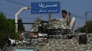 A Lebanese soldier stands atop an armored personnel carrier while manning a checkpoint at the entrance to Srifa village in southern Lebanon, Tuesday, 21 July, 2026.