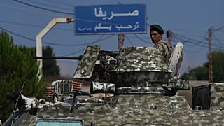 A Lebanese soldier stands atop an armored personnel carrier while manning a checkpoint at the entrance to Srifa village in southern Lebanon, Tuesday, 21 July, 2026.
