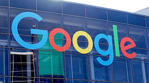 FILE - Sign on a Google building at its campus in Mountain View, California.