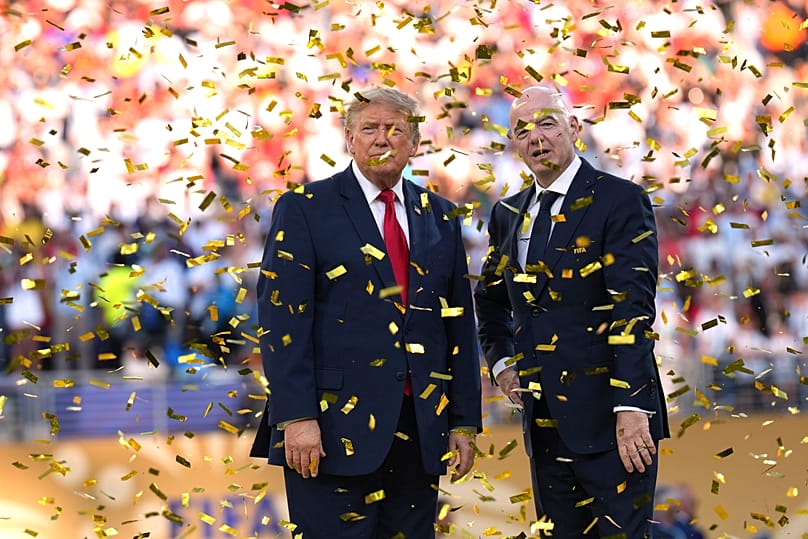 President Donald Trump, left, and FIFA President Gianni Infantino watch confetti fall at the conclusion of the World Cup championship final soccer match.