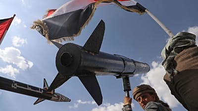 FILE: A Houthi supporter chants slogans as he carries a rocket replica during a rally in Sana'a, Yemen, following Israeli airstrikes in Sanaa, 26 September 2025