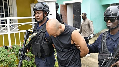 A photo showing a man being arrested following a raid by the Liberian National Police on 21 July 2026. Credit: Liberian National Police/Facebook. - Copyright  Liberia National