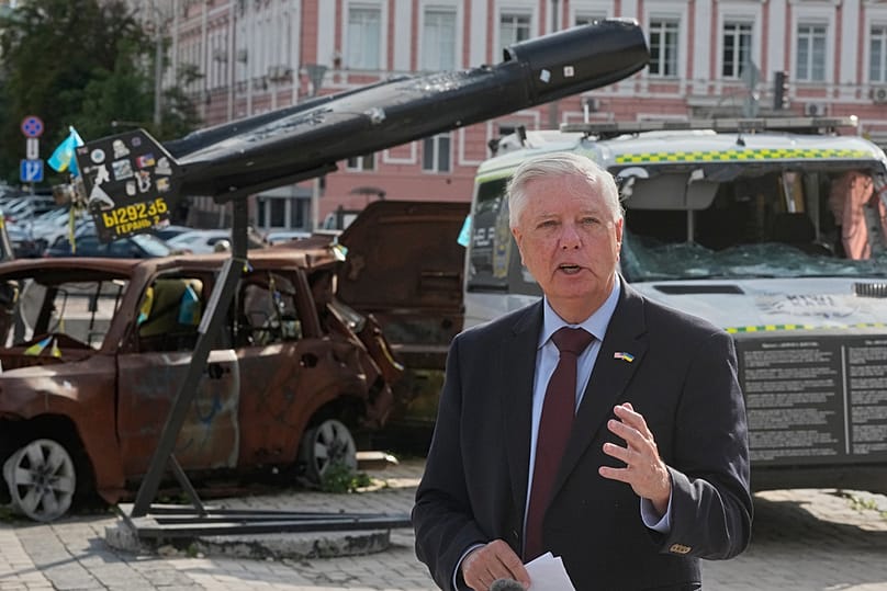 U.S. Sen. Lindsey Graham, R-S.C. answer media questions near damaged Russian vehicles exhibition in central Kyiv, Friday, July 10, 2026. 