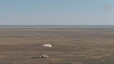 Screenshot from NASA video of the crew's landing.
