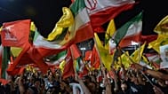 أنصار حزب الله يلوحون بأعلام الحزب والأعلام الإيرانية خلال تجمع في الضاحية الجنوبية لبيروت، لبنان، يوم الأربعاء 8 يوليو 2026