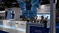 FILE - A worker at the booth for Chinese DRAM producer ChangXin Memory Technologies, also known as CXMT, waits for visitors at the 21st China International Semiconductor Expo.