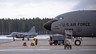 A fighter jet, left, passes a US KC-135 Stratotanker, a US military tanker aircraft, during a military exercise near  Luleå, Sweden, March 4, 2024
