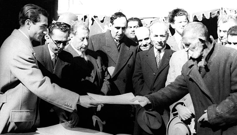 Iran's Shah Reza Pahlevi, visits with 143 peasants of this village, Davudabad, 1951 to attend land reform ceremony