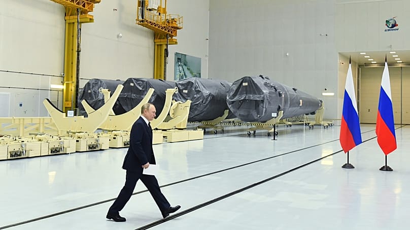 Russian President Vladimir Putin walks at a rocket assembly factory outside the city of Tsiolkovsky, Russia, Tuesday, 12 April, 2022. 