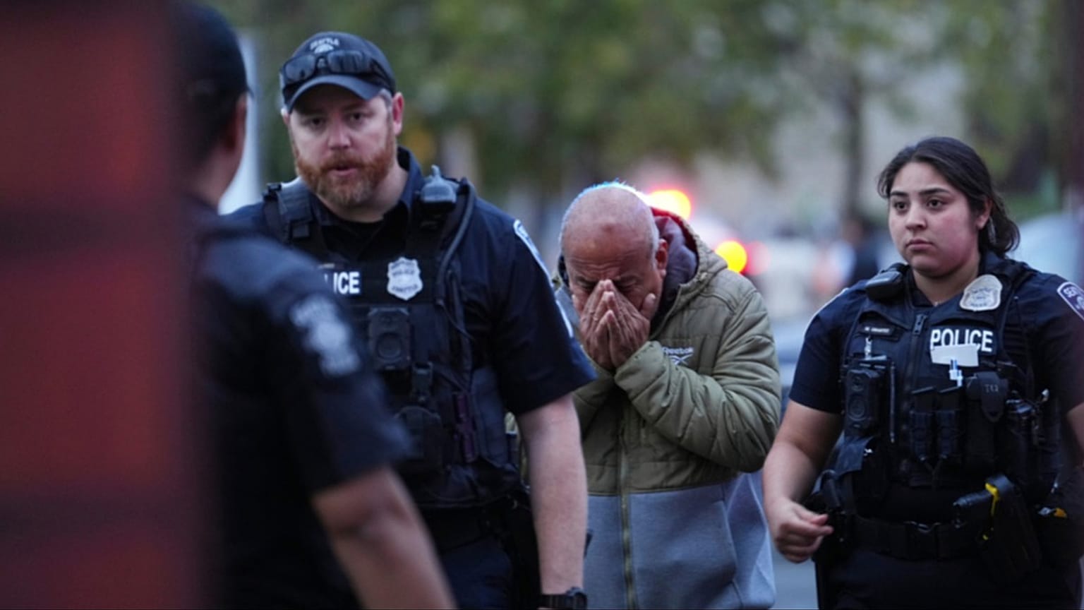 A man is led into the scene by police after they responded to a shooting during the Bite of Seattle food festival Sunday, July 26, 2026, in Seattle, Washington
