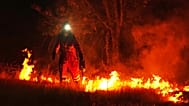 Firefighters use controlled burning to halt a wildfire that continues to spread near Cebreros, Spain. 28 July, 2026.