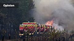 Firefighters attempt to suppress a blaze in a forest as wildfires rage near Le Las, outside Bordeaux, France, Monday, July 27, 2026. (AP Photo/Emma Da Silva)