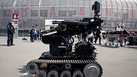 FILE - Police officers using a robot conduct a security exercise at the Pierre Mauroy Stadium, Villeneuve d'Ascq, northern France, Thursday April 21, 2016.