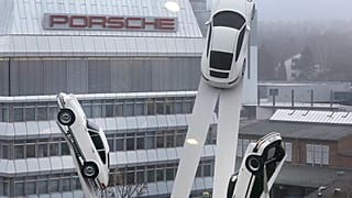 File - A sculpture with Porsche cars stands in the compound of the Porsche car manufactory in Stuttgart, 11 March 2016.