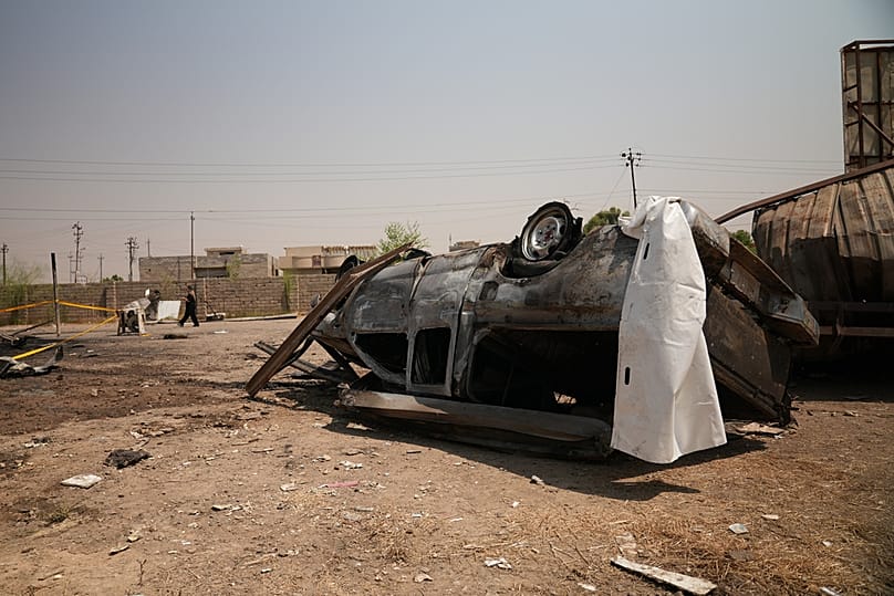 A damaged vehicle at the site of an airstrike on a Popular Mobilization Forces base in Mosul, Iraq, Wednesday, July 29, 2026