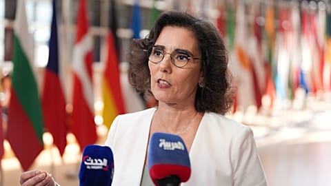 European Commissioner for Preparedness and Crisis Hadja Lahbib speaks with the media as she arrives for a meeting of EU foreign ministers in Brussels, Monday, July 13, 2026.