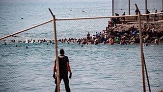Ceuta calls for emergency as thousands of migrants cross